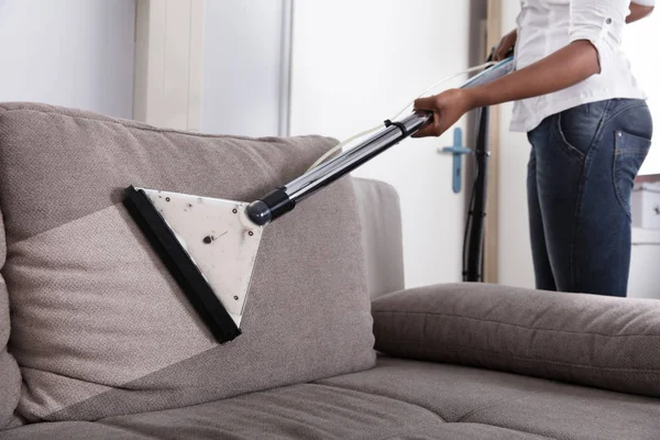 Housewife Cleaning Sofa