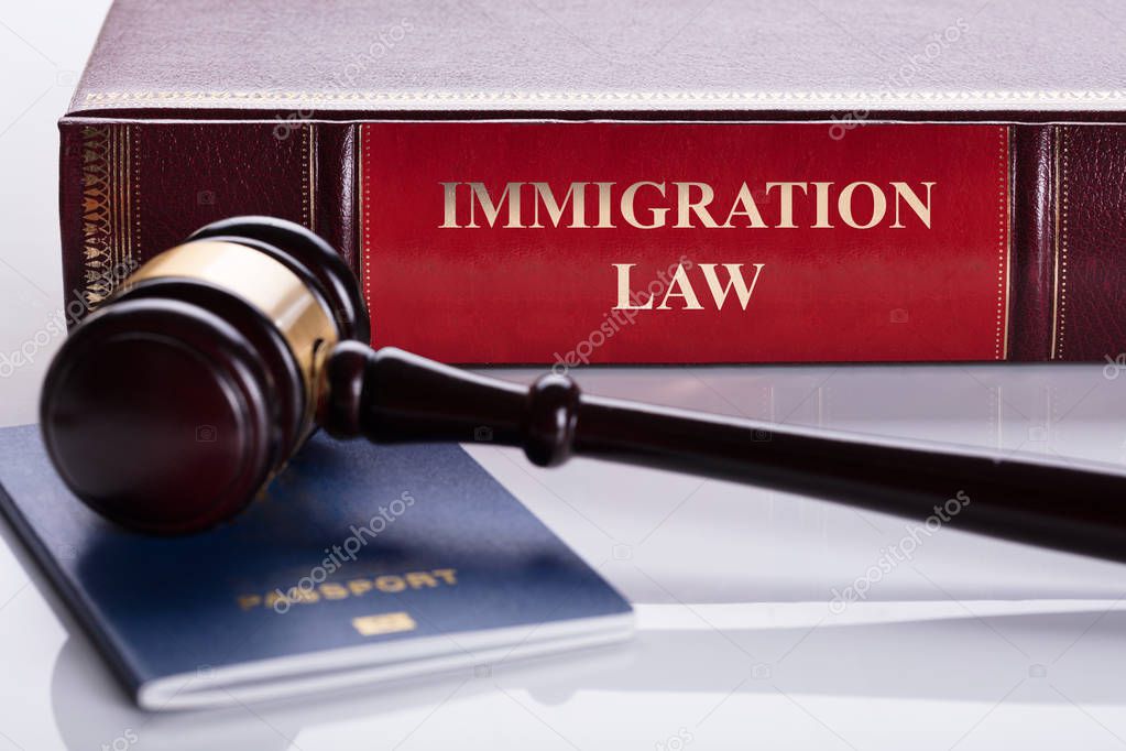 Passport In Front Of Law Book — Stock Photo © AndreyPopov 175976498