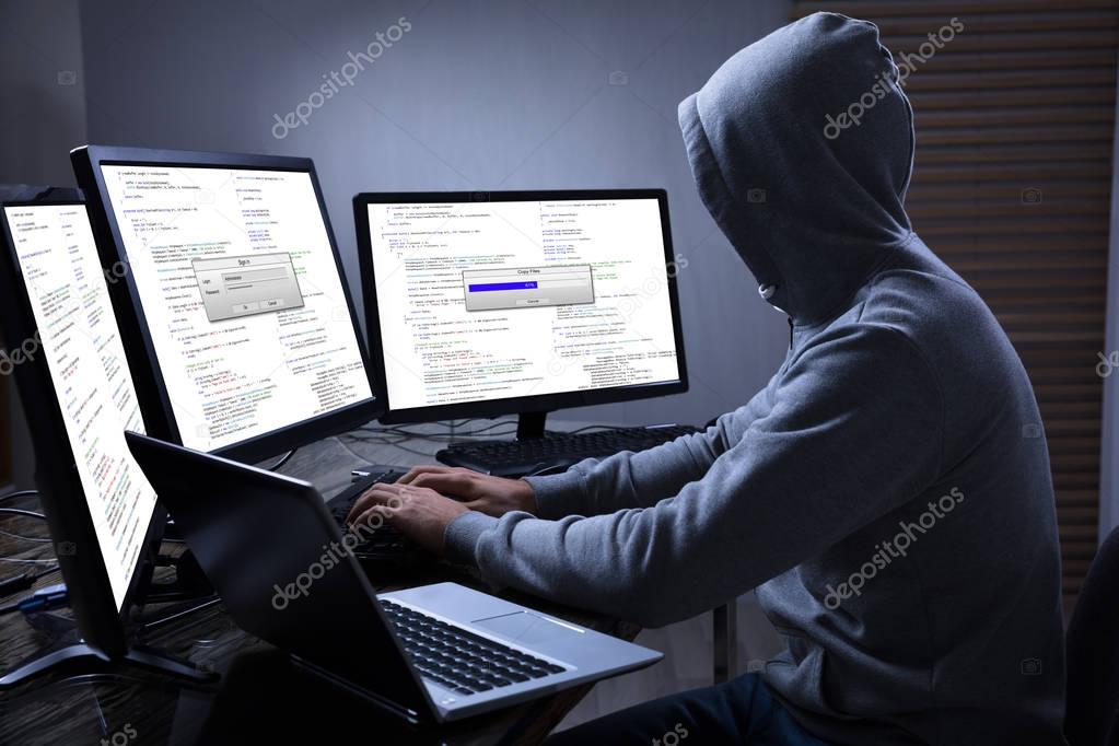 Hacker Using Multiple Computers