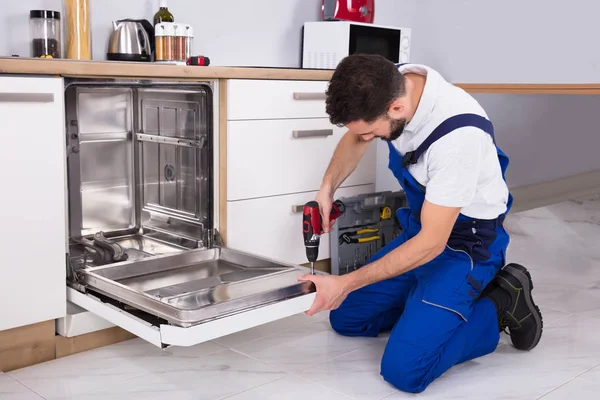 Technician Repairing Dishwasher — Stock Photo, Image