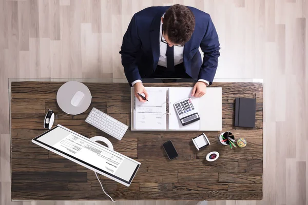 Businessman Calculating Invoice — Stock Photo, Image