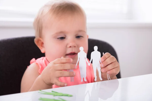 Baby Holding Paper Cut