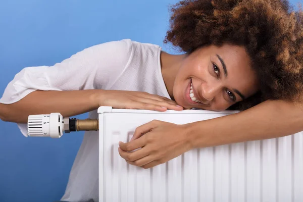 Portrait Happy Young Woman Leaning Heating Radiator — Stock Photo, Image