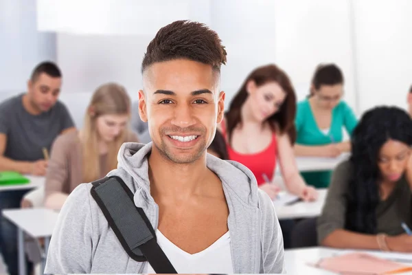 Portrait Smiling Male Student Standing Classroom — Stock Photo, Image