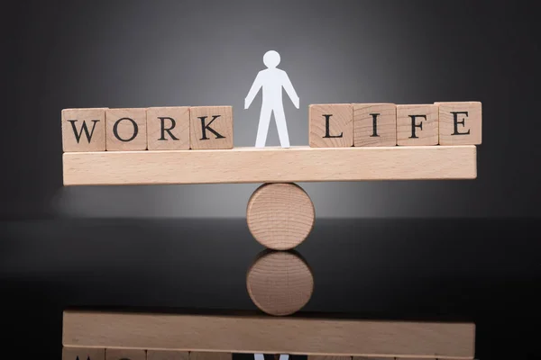 Human Figure Balancing Work Life Wooden Seesaw Black Background — Stock Photo, Image