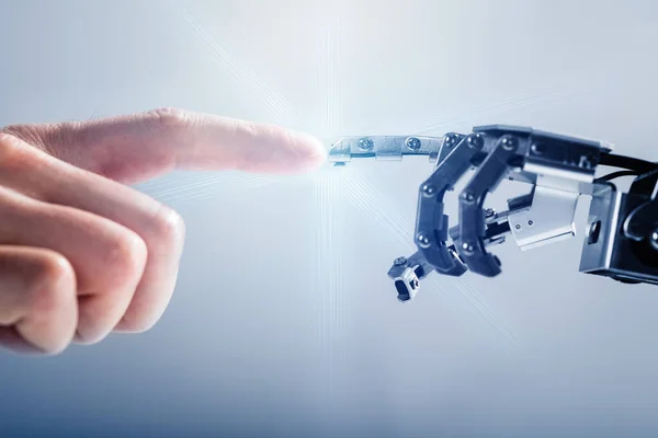 Крупный План Пальца Предпринимателя Касающегося Роботизированного Пальца Синем Фоне — стоковое фото