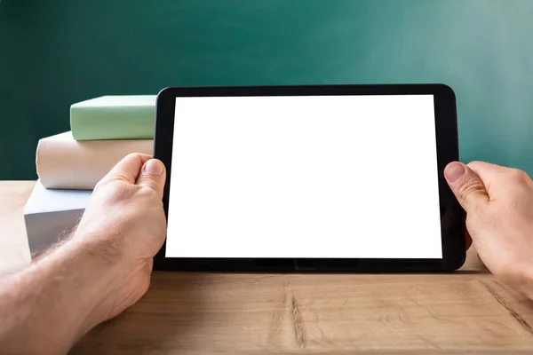 Human Hand Digital Tablet Showing Blank White Screen Front Blackboard — стоковое фото