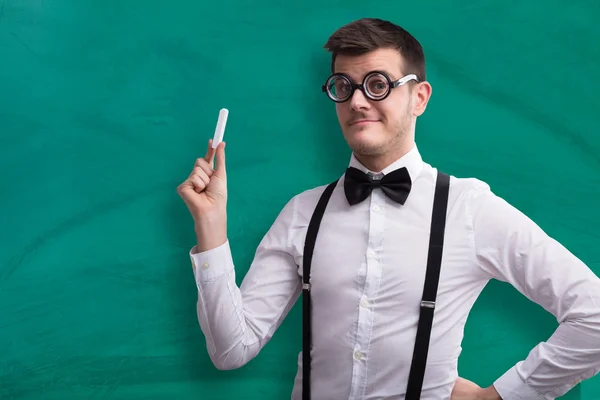 Close Young Male Teacher Holding Chalk Green Chalkboard — Stock Photo, Image