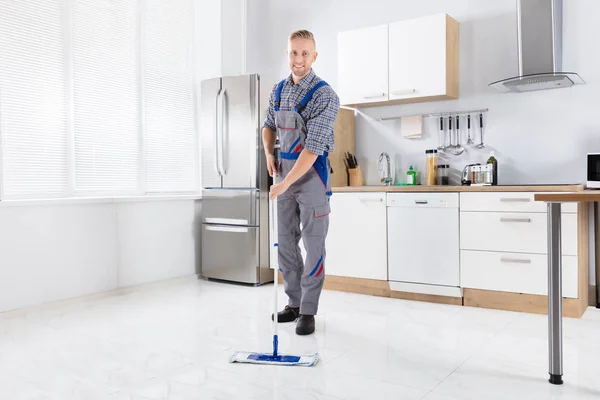 Happy Young Male Worker Mopping Floor Mop Kitchen — Stock Photo, Image