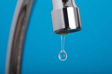 Close-up Of Leakage Tap With Dripping Water Drop clipart
