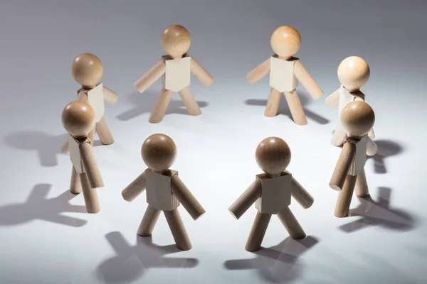 Wooden Human Figures Forming Circle Standing White Background — Stock Photo, Image