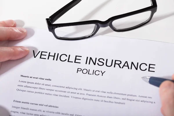 Elevated View Person Hand Holding Pen Vehicle Insurance Policy Form — Stock Photo, Image