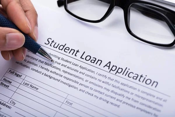 Close Person Hand Filling Student Loan Application Form — Stock Photo, Image