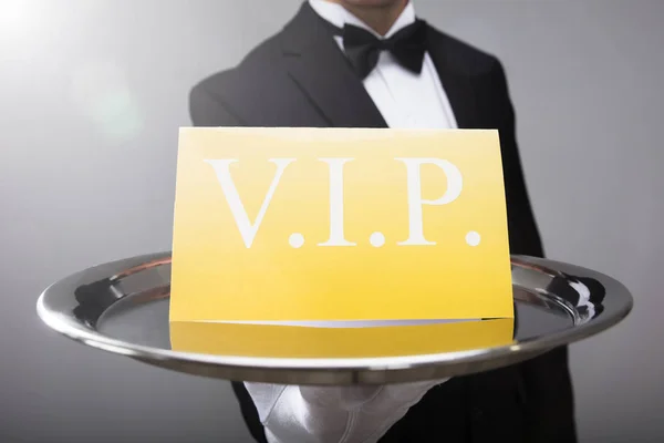 Close Waiter Hand Showing Vip Text Banner — Stock Photo, Image