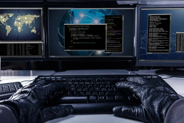 Hacker Wearing Gloves Typing Code Keyboard Front Multiple Computers — Stock Photo, Image