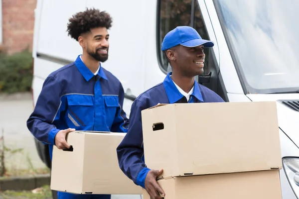 Close Dois Homens Entrega Segurando Caixas Papelão — Fotografia de Stock