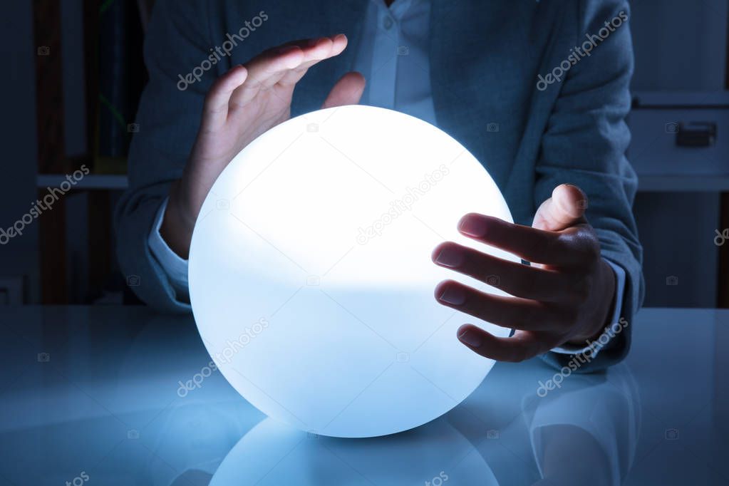 Portrait Of A Afro American Businesswoman Hand On Crystal Ball In Office