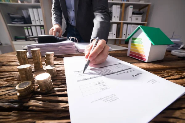 Businessperson Calculating Bill Coins House Model Showing Energy Efficiency Rate — Stock Photo, Image