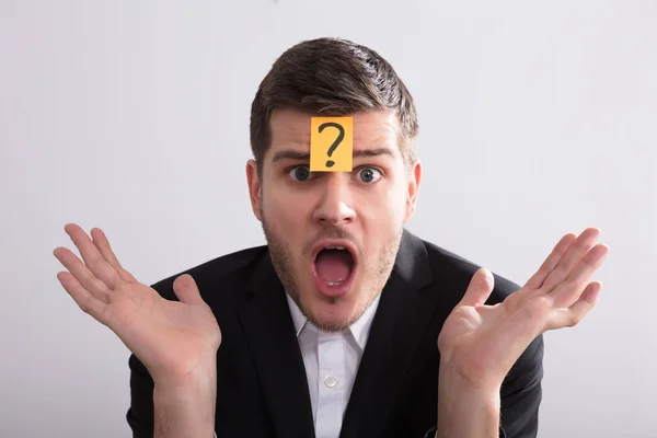 Close Young Businessman Sticky Notes His Forehead Showing Question Mark — Stok Foto