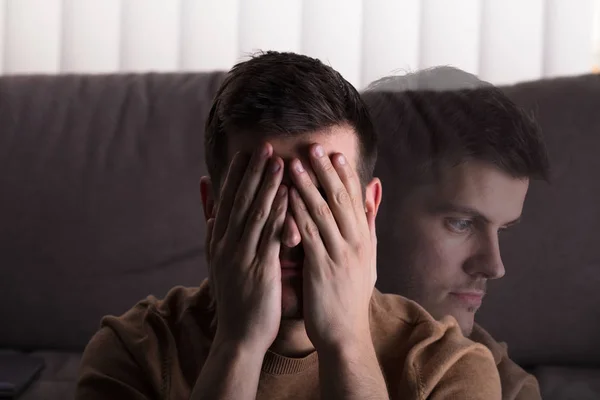 Joven Hombre Triste Sentado Frente Sofá Casa —  Fotos de Stock