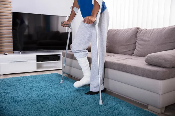 Man Broken Leg Using Crutches Walking Blue Carpet — Stock Photo, Image