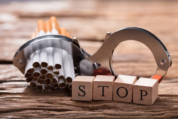 Close Cigarettes Handcuff Wooden Blocks Showing Stop Word Desk — Stock Photo, Image