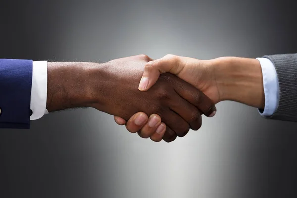 Close Multiethnic Hands Shaking Gray Background — Stock Photo, Image