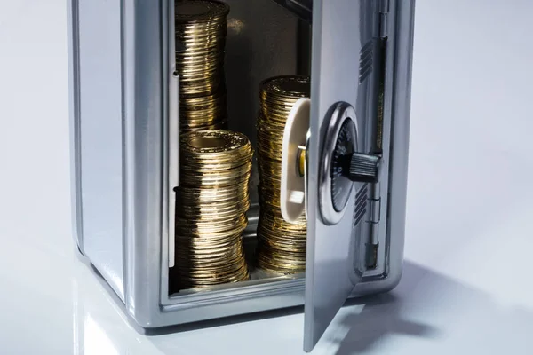 Close-up Of An Open Safe With Stacked Golden Coins