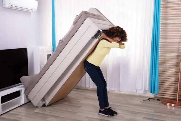 Side View Young Woman Lifting Sofa Living Room — Stok Foto