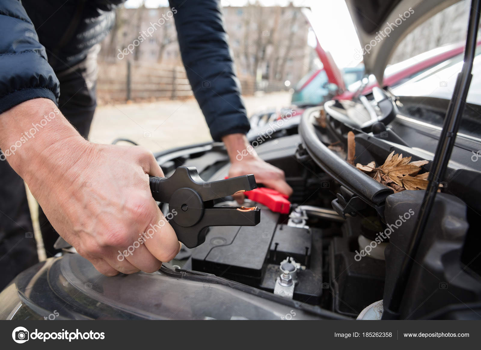 Close Person's Hand Using Jumper Cables Charge Car's Dead Battery Stock
