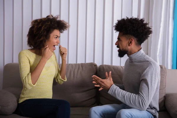 Young Couple Sitting Sofa Quarreling Each Other Home — Stock Photo