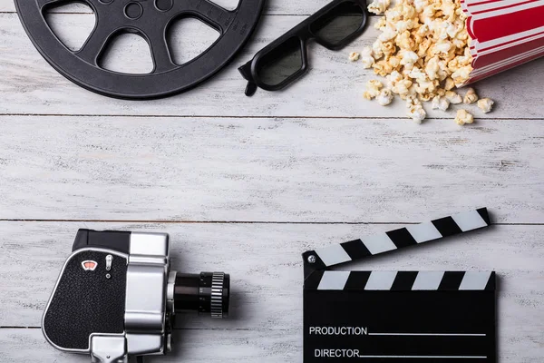 Elevated View Spilled Popcorn Clapperboard Glasses Film Reel Movie Camera — Stock Photo, Image