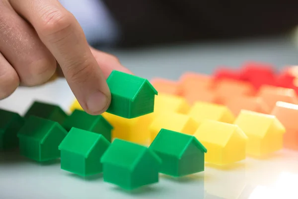 Close Person Hand Arranging Green House Model Row — Stock Photo, Image