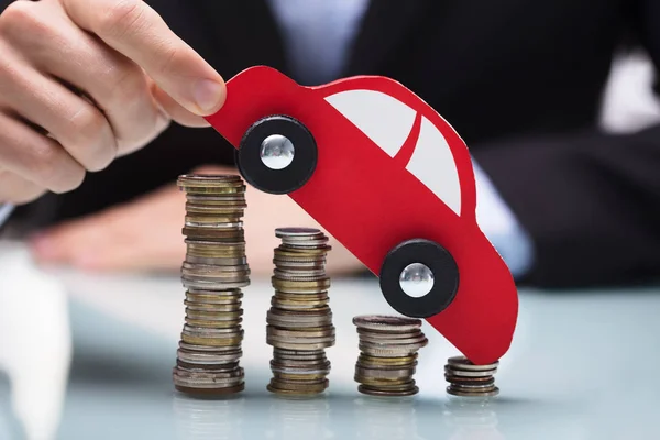 Close Businessman Hand Holding Red Car Stacked Coins Desk — Stock Photo, Image