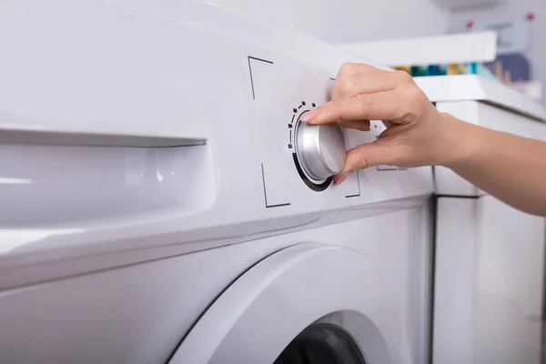 Close Woman Hand Turning Button Washing Machine — Stock Photo, Image