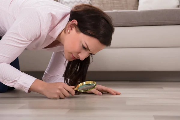 Side View Young Woman Looking Hardwood Floor Magnifying Glass — Stock Photo, Image