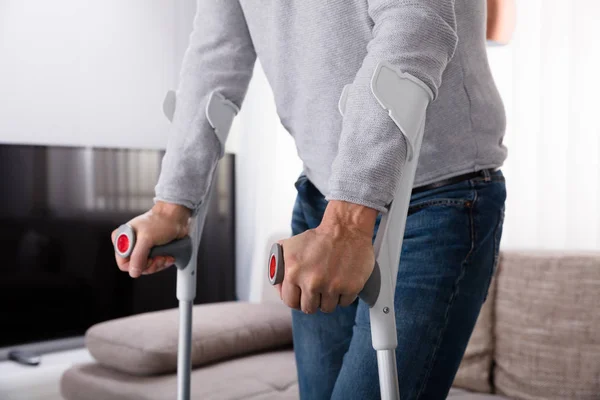 Mid Section View Man Broken Leg Using Crutches Home — Stock Photo, Image