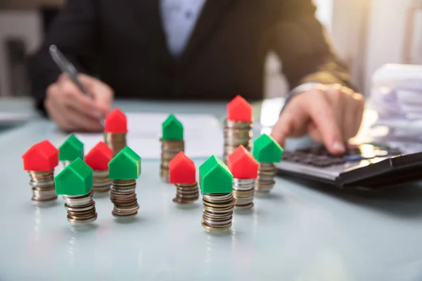 Close Green Red House Model Stacked Coins Businessperson Hand Using — Stock Photo, Image