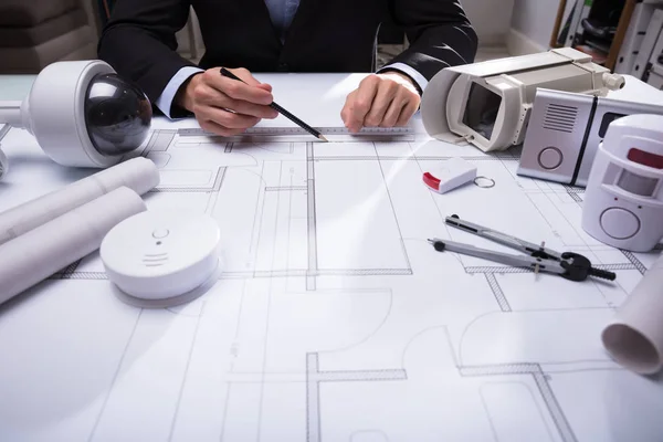 Close Architect Hand Drawing Blueprint Security Equipments Desk — Stock Photo, Image