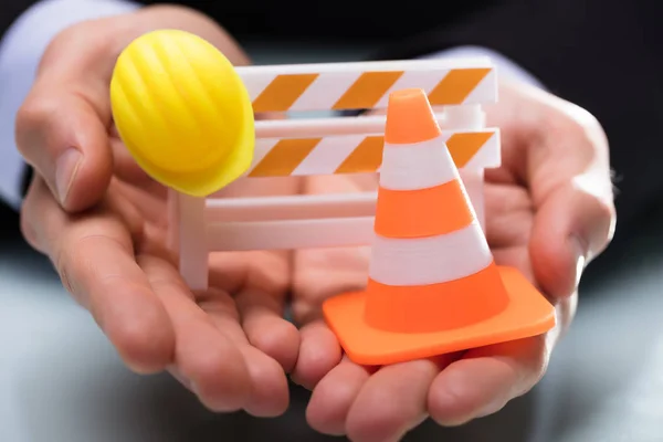 Close Person Hand Holding Barricade Traffic Cone Hard Hat — Stock Photo, Image