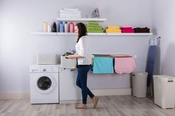 Smiling Young Woman Standing Washing Machine Basket Clothes Kitchen — Stock Photo, Image