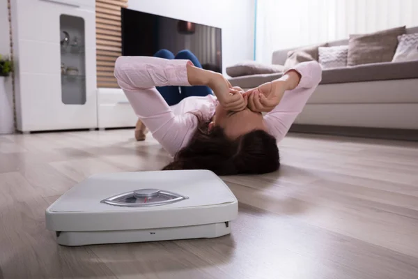 Close Weighing Scale Woman Lying Hardwood Floor — Stock Photo, Image