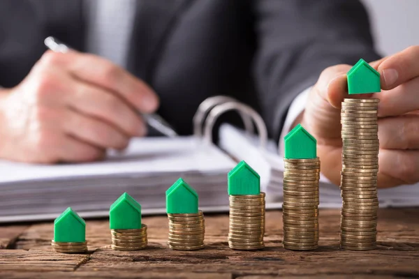 Businessperson Hand Placing Green House Model Increasing Stacked Coins Wooden — Stock Photo, Image