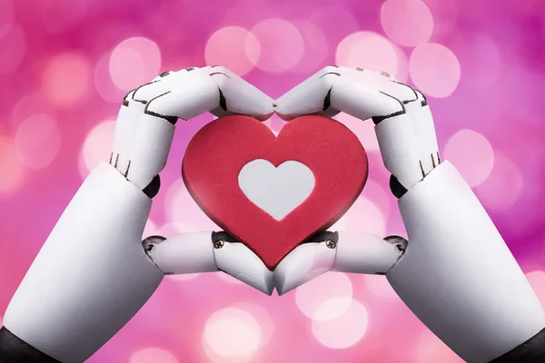 Detail Robotické Ruky Držící Červené Srdce Pozadí Bokeh — Stock fotografie