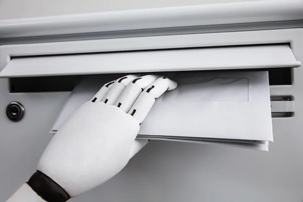 Close Robotic Hand Inserting Envelope Mailbox — Stok Foto