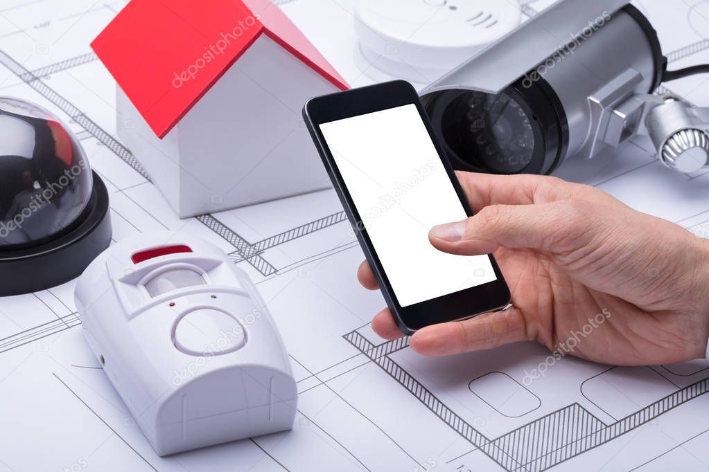 Architect's Hand Using Mobile Phone With Blank White Screen