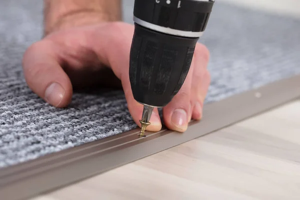 Close Carpet Fitter Hand Installing Grey Carpet Wireless Screwdriver — Stock Photo, Image