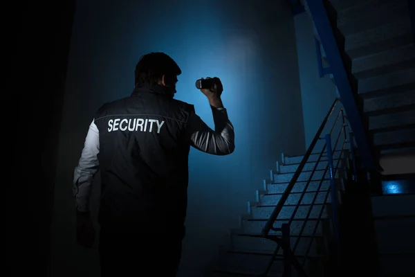 Rear View Security Guard Standing Stairway Holding Flashlight — Stock Photo, Image