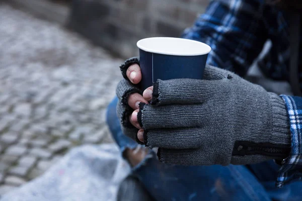 Beggar Hand Wearing Gloves Holding Disposable Cup — Stock Photo, Image