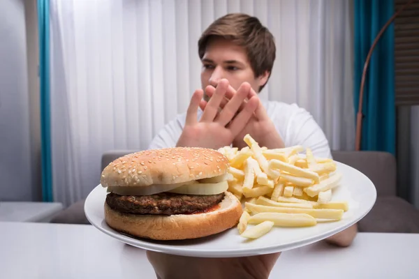 Man Refusing Unhealthy Food Offered Person — Stock Photo, Image